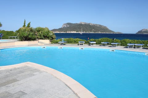 Swim in the communal pool to cool off in the Sardinian heat