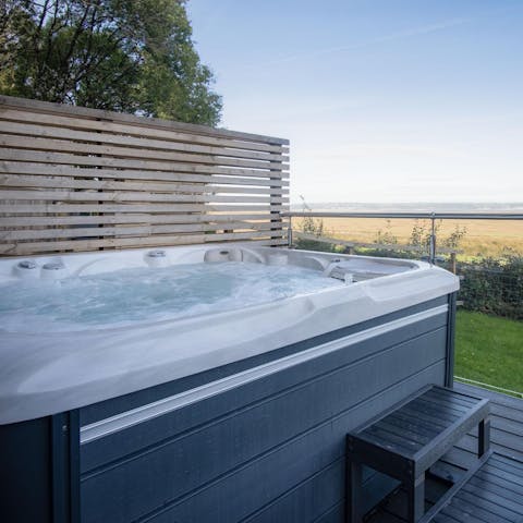 Relax in the hot tub with a glass of fizz and take in the Gower countryside views