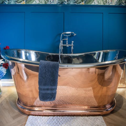 Have a luxurious soak in the copper roll-top bath