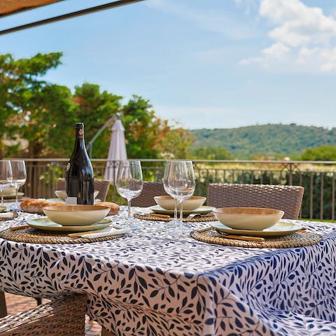 Enjoy a view of the hills from the dining terrace