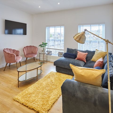 Relax on vintage-style seats in the sunny living room