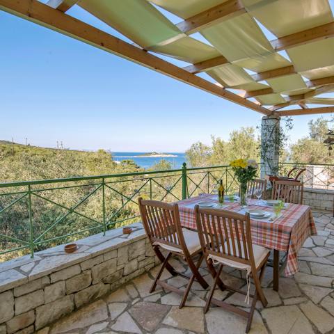 Marvel at stunning sea views from the shaded outdoor dining terrace