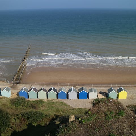 Dander down to the sandy beach at the bottom of the cliff