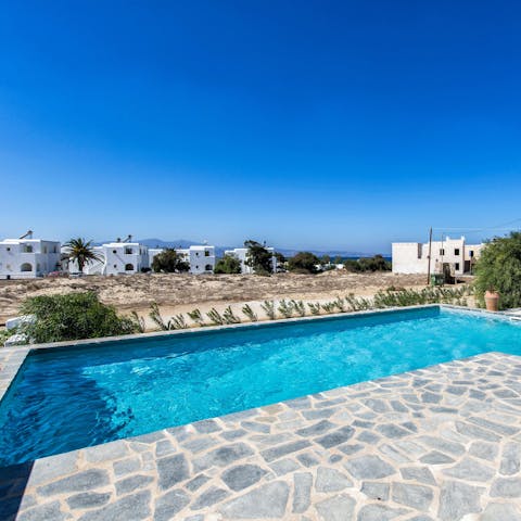 Enjoy a swim in the communal pool to cool off in the Greek heat