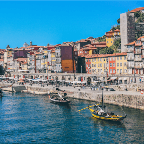 Cross the Luís I Bridge and stroll along the Cais da Ribeira