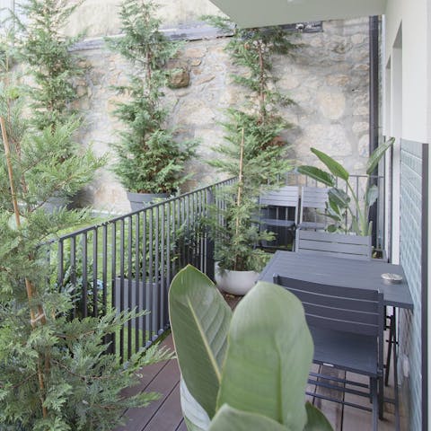 Enjoy a pastel de nata and an espresso on the balcony