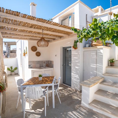 Spend idyllic afternoons relaxing in the shade on the covered terrace