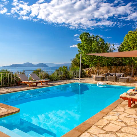 Jump into the swimming pool and spend the day splashing in the Grecian sun