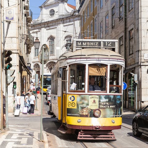 Ride a tram through the city of Lisbon, just a nine–minute walk away