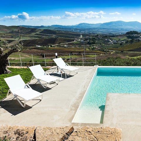 Soak up the Sicilian sun from in or beside the private pool