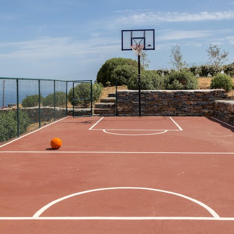 Play a game of basketball on the court