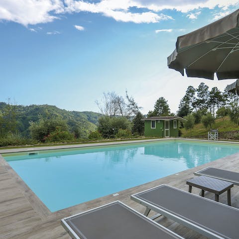 Take a dip in the pool, overlooking the Tuscan hills