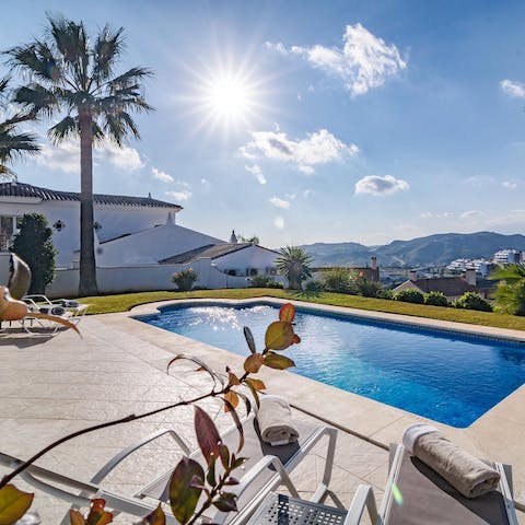 Soak up views of the Marbella Mountains from the luxurious poolside