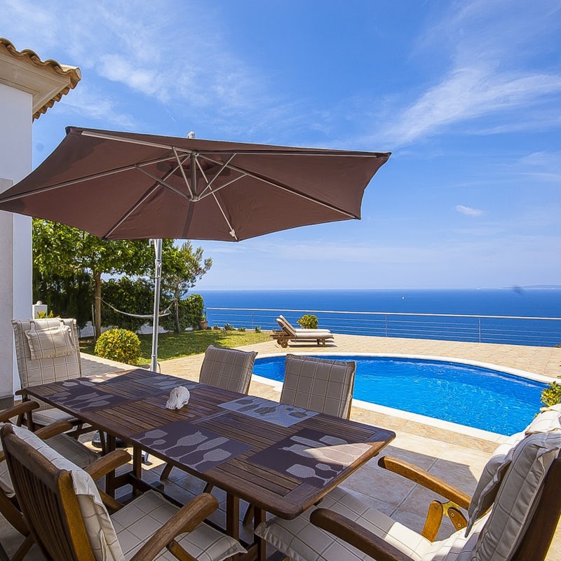 Dine alfresco in the shade by the pool