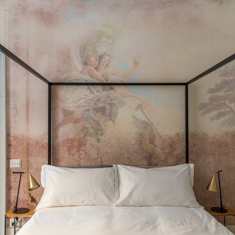 Enjoy a lazy morning under the gorgeous bedroom mural