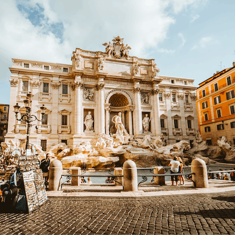 Take a scenic walk through Rome to the beautiful and ornate Trevi Fountain