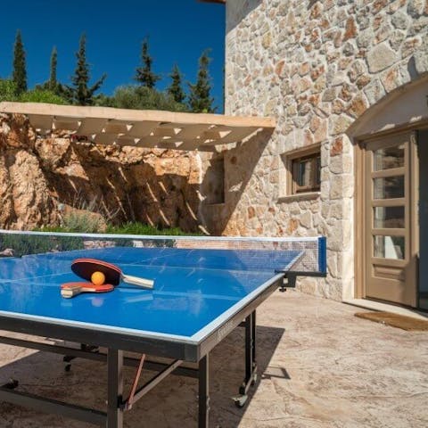 Play a game of ping pong in the afternoon sun
