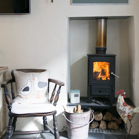 Cosy up with a good book by the warming wood-burning stove