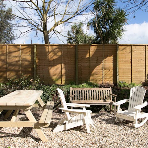 Spend lazy days relaxing in your charming back garden