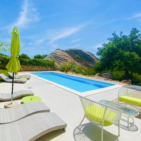 Soak up some rays from the private pool's inviting waters