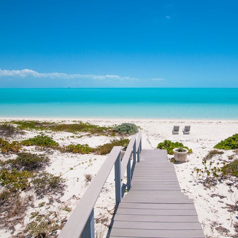 Step directly onto the idyllic white sand beach 