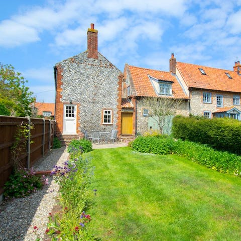 Soak up the British sunshine in the garden, complete with lush lawn