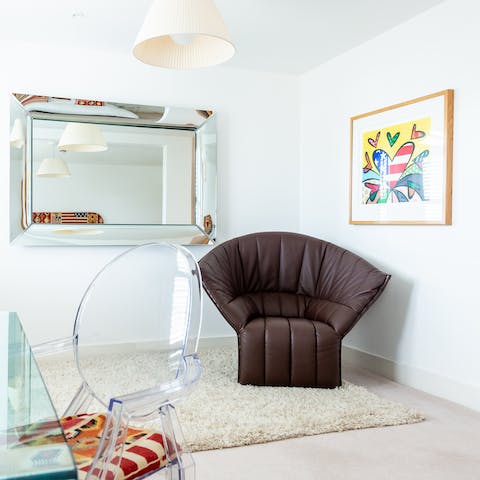 Make yourself comfortable on the master bedroom's Moël leather chair designed by famous French designer Inga Sempé