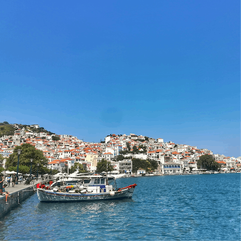 Take the eighteen-minute walk into Skopelos Town and admire the picturesque scenes