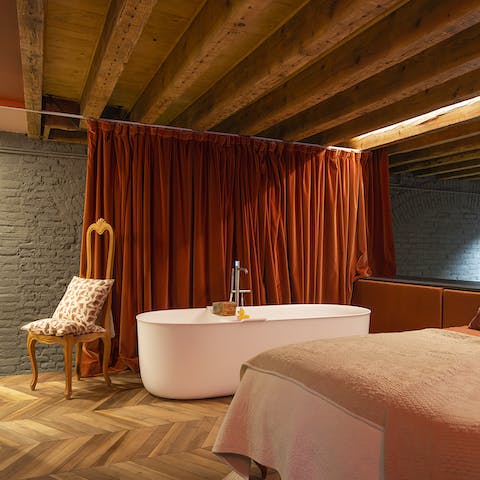 Enjoy a luxurious soak in the bedroom's freestanding bathtub