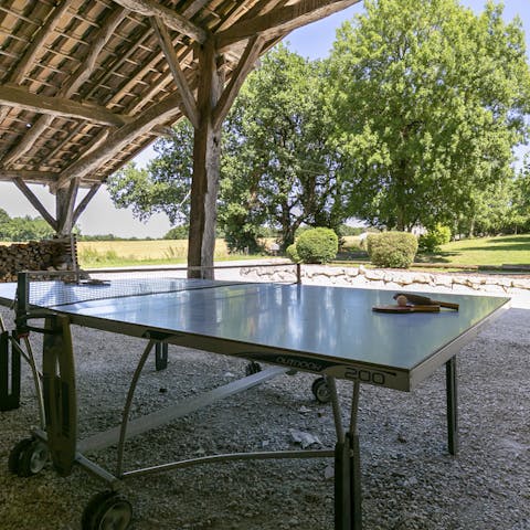 Get a friendly ping pong tournament going in the shade