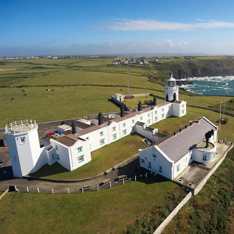 Stay in an operational lighthouse right on the coast