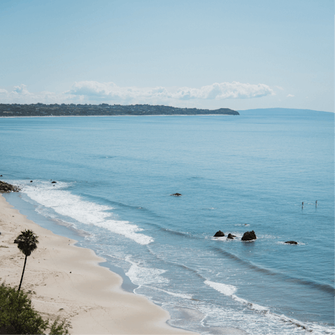 Experience the breezy lifestyle of Malibu, where surfers cross paths with celebrities