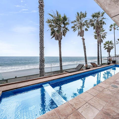 Stay on the palm-lined beachfront, with spectacular views over the North Pacific Ocean