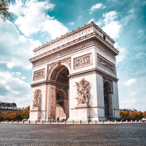 Visit Paris' iconic Arc de Triomphe, a short walk away