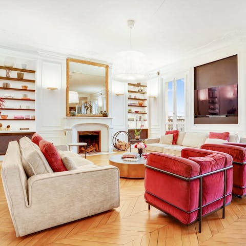 Relax in the elegant living room with a glass of wine, courtesy of the wine cellar