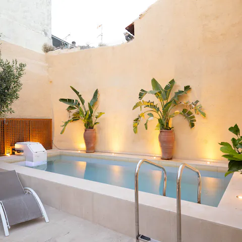 Treat yourself to an alfresco dip in the villa's heated swimming pool