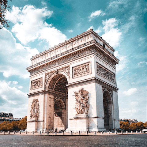 Gaze up at the famous Arc de Triomphe, a five-minute walk away