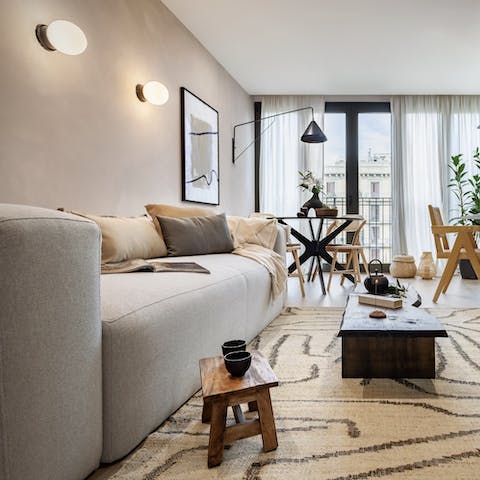 Chill out in the stylish living space after a busy day navigating Barcelona's charming streets