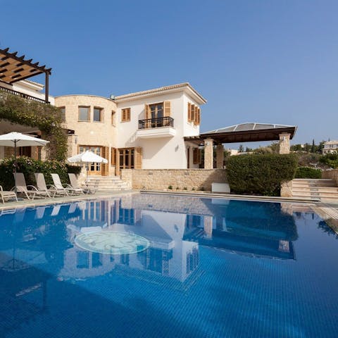 Cool off in the crystalline waters of the outdoor pool