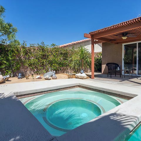 Unwind in the soothing bubbles of the hot tub