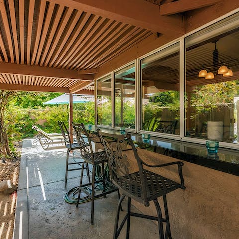 Sip a cocktail at the shaded bar area
