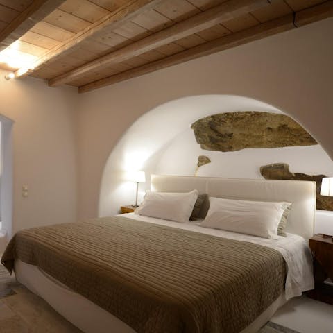 Fall asleep underneath traditional arches in the comfortable bedrooms