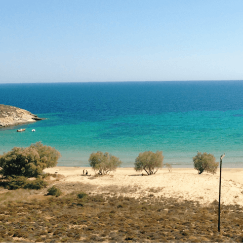 Drive ten minutes to the Platis Gialos beach or hire a boat and explore the more secluded spots