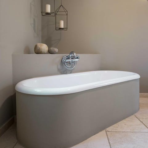Enjoy a luxurious soak in the tub after spending a day at the beach