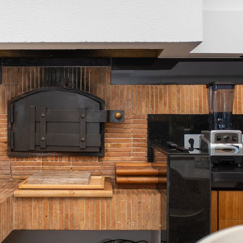 Cook up a culinary feast in the professional kitchen and pizza oven for the whole family to enjoy