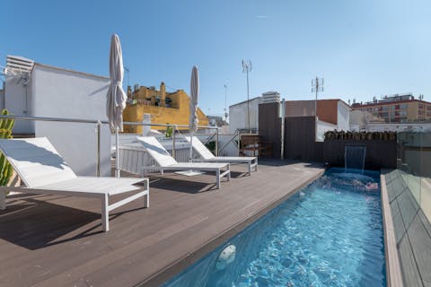 Soak up the Spanish rays from the sleek sun loungers on the shared rooftop