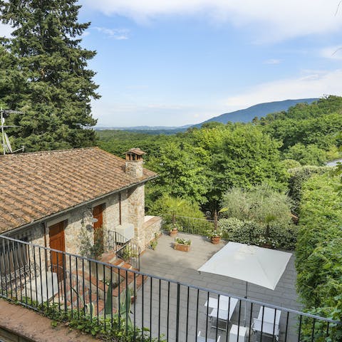 Head up to the balcony and enjoy the views of rolling Tuscan countryside