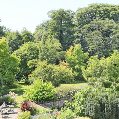 Spend lazy afternoons basking in the extensive gardens