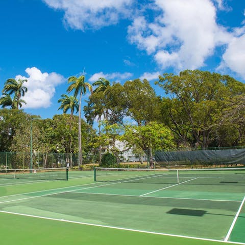 Challenge your loved ones to a few games of tennis on the communal courts