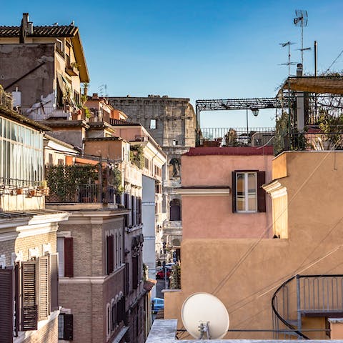 Catch a glimpse of the Colosseum walls from your central apartment